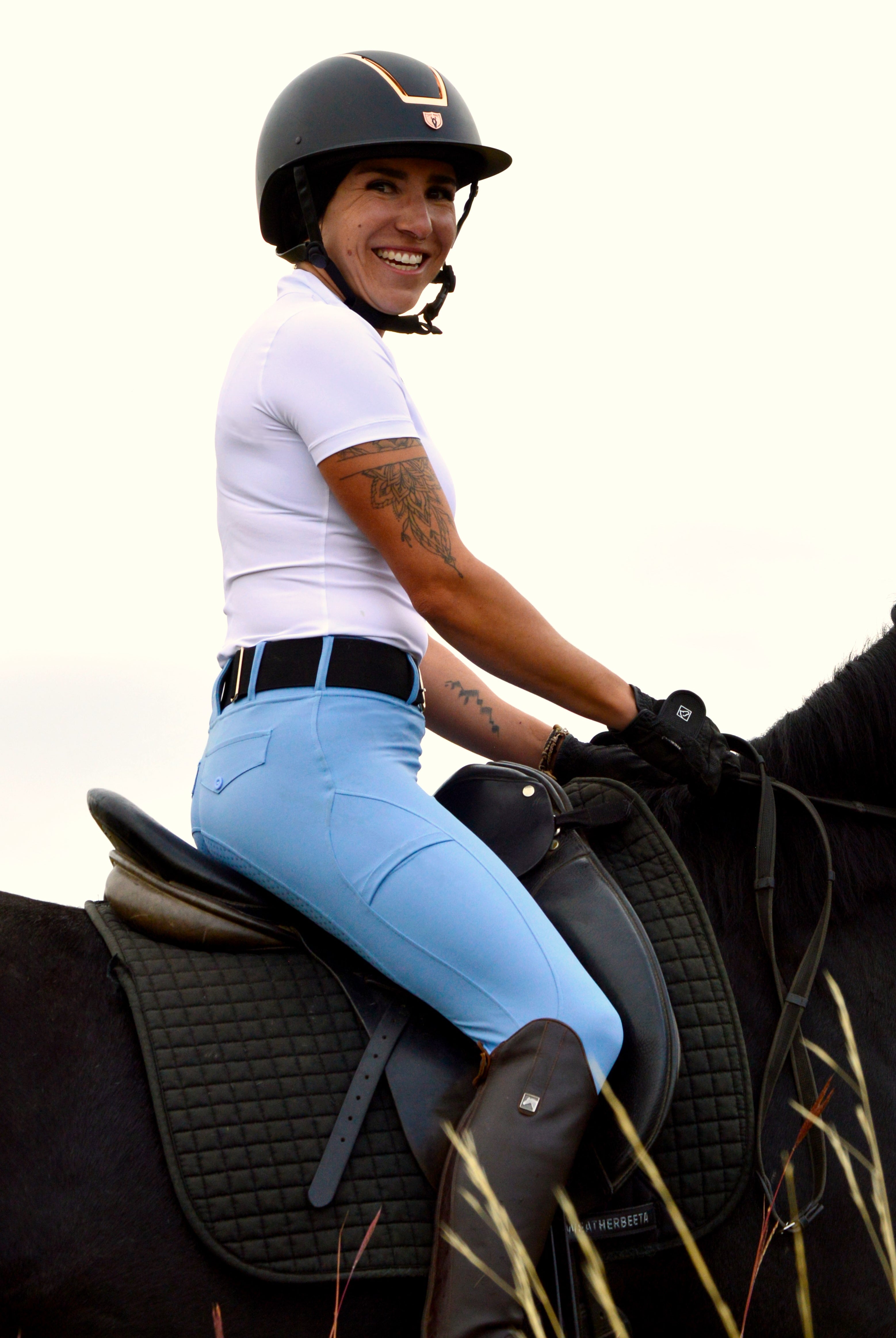 Stunning riding tights in baby blue matched with white equestrian base layer and black snaffle belt