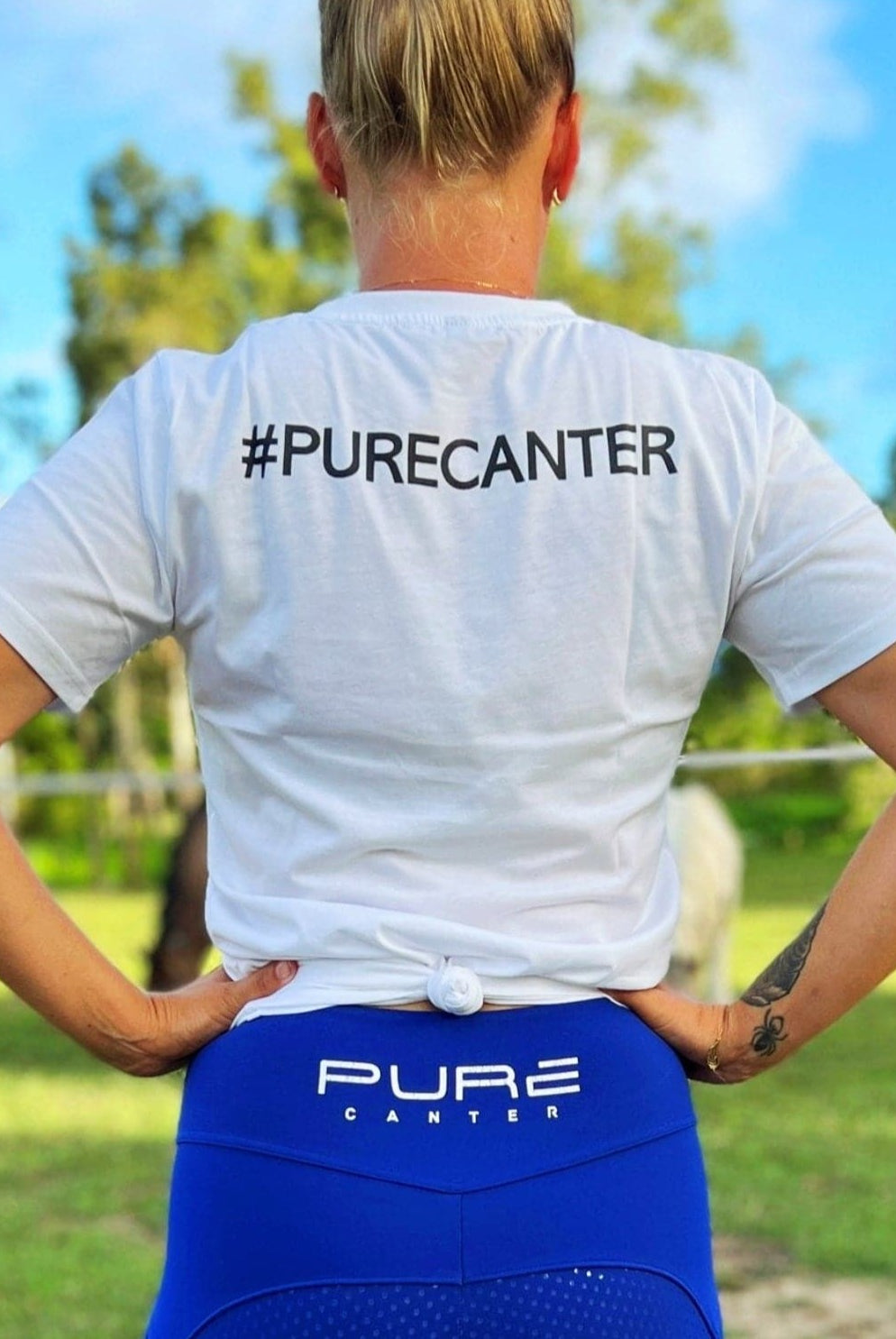 back view of Pure Canter Emblem shirt showing of the hashtag